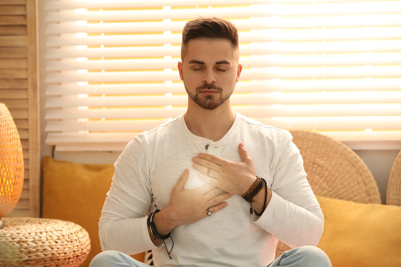 Young Man during Self-Healing Session in  Room